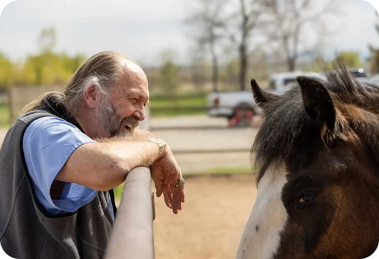 Dr. Kirk Mitchell with one of his horses at Meadowlark Ranch